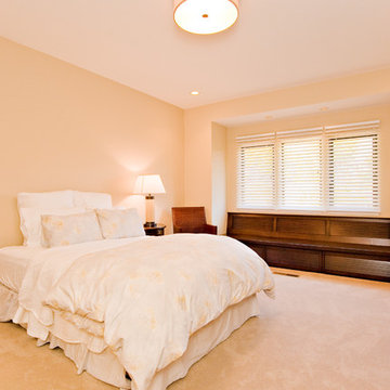 guest bedroom with custom cabinetry window seat