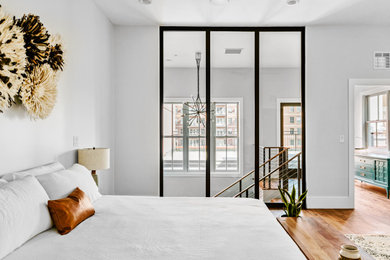Example of an urban bedroom design in Denver