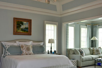 Example of a transitional master carpeted bedroom design in Kansas City with blue walls