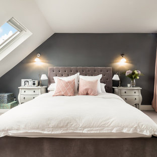 Design ideas for a traditional guest bedroom in London with grey walls, carpet, no fireplace and beige floors.
