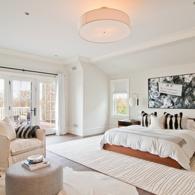 Transitional dark wood floor bedroom photo in New York with white walls