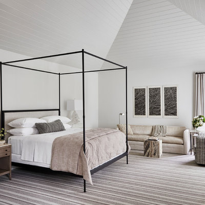 Example of a beach style master carpeted and multicolored floor bedroom design in Dallas with white walls
