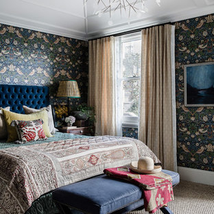 This is an example of an eclectic bedroom in Sydney with multi-coloured walls, carpet and beige floor.