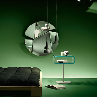 Diseño de habitación de invitados actual, de tamaño medio, con paredes verdes, suelo vinílico y suelo verde