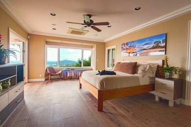 Bedroom - large tropical master bedroom idea in Hawaii with beige walls