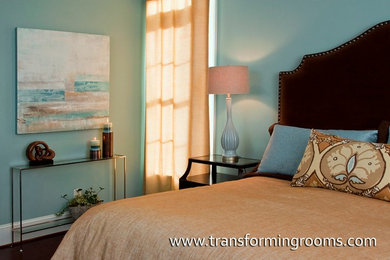 Inspiration for a large transitional master bedroom remodel in Other with beige walls