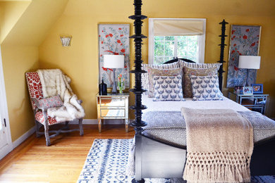 Mid-sized farmhouse guest medium tone wood floor and brown floor bedroom photo in San Francisco with yellow walls