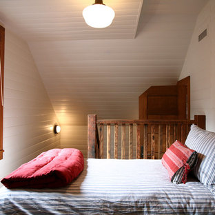 Mountain style loft-style bedroom photo in Seattle with white walls