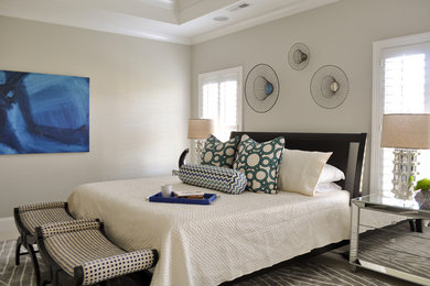 This is an example of a modern master bedroom in Charlotte with grey walls.