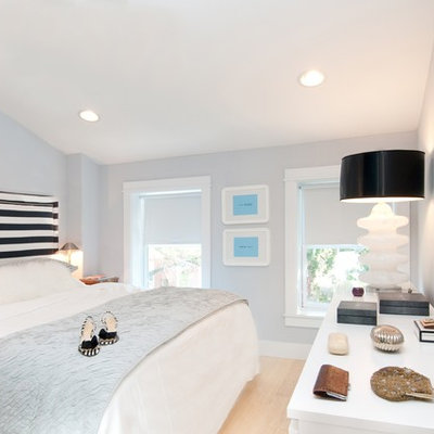 Inspiration for a small contemporary master light wood floor bedroom remodel in Bridgeport with blue walls and no fireplace