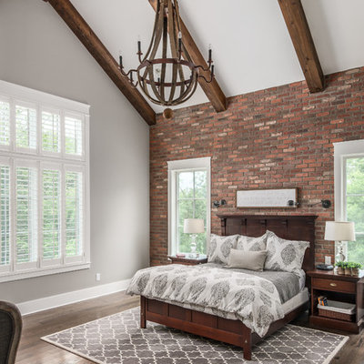 Elegant master dark wood floor bedroom photo in Nashville with gray walls