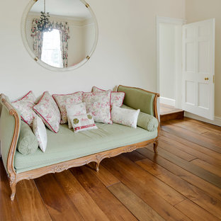 Inspiration for a mid-sized victorian master bedroom in Other with multi-coloured walls, medium hardwood floors, no fireplace and brown floor.