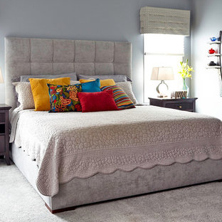 Bedroom - large transitional master carpeted bedroom idea in Other with gray walls