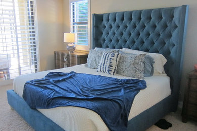 Example of a mid-sized classic guest carpeted bedroom design in Miami with beige walls and no fireplace