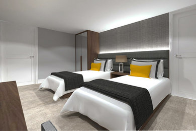 Inspiration for a contemporary guest bedroom in London with grey walls and carpet.