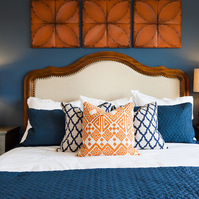 Example of a transitional bedroom design in Houston with blue walls