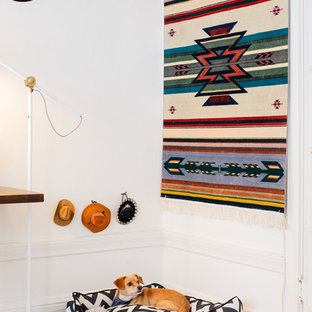 Inspiration for an eclectic medium tone wood floor bedroom remodel in San Francisco with white walls