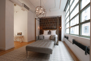 Inspiration for a contemporary bedroom remodel in New York with white walls