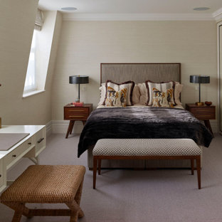 Photo of a medium sized contemporary master bedroom in London with beige walls, carpet and grey floors.