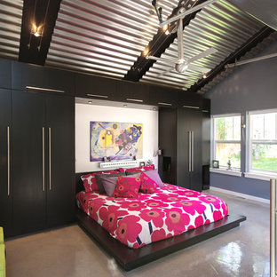 Modelo de dormitorio actual con suelo de cemento