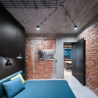 Inspiration for a medium sized urban bedroom in London with black walls and grey floors.