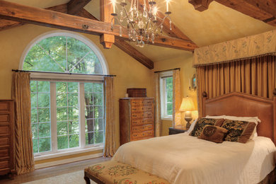 Example of a transitional bedroom design in Houston