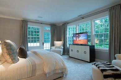 Inspiration for a large bedroom remodel in New York with gray walls