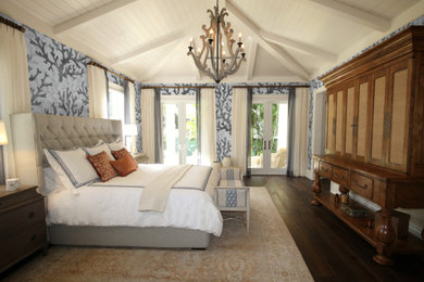 Beach style master dark wood floor and brown floor bedroom photo in Atlanta with gray walls and no fireplace