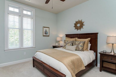 Mid-sized elegant master carpeted and gray floor bedroom photo in Charlotte with blue walls