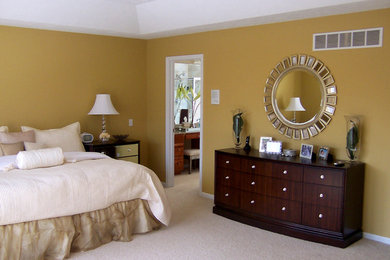 Large transitional master carpeted bedroom photo in Grand Rapids with yellow walls and no fireplace