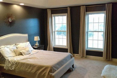 Inspiration for a mid-sized modern master bedroom remodel in New York with black walls
