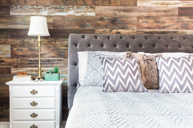 Mid-sized mountain style loft-style medium tone wood floor bedroom photo in Atlanta with brown walls