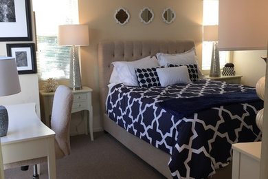 Inspiration for a contemporary beige floor bedroom remodel in Tampa with beige walls