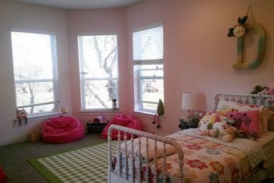 Large carpeted bedroom photo in Dallas with pink walls