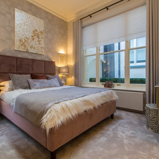 Photo of a contemporary bedroom in Dorset with grey walls, carpet and grey floors.