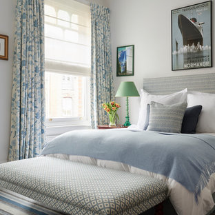 Design ideas for a large bohemian master bedroom in London with white walls and carpet.