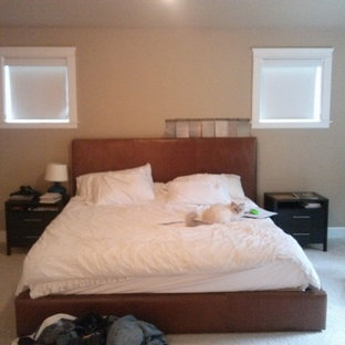 Example of a mid-sized minimalist master carpeted bedroom design in Seattle with beige walls and no fireplace