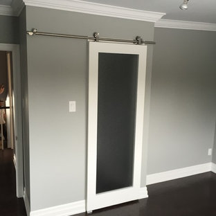 Inspiration for a mid-sized contemporary master bedroom in Toronto with grey walls, dark hardwood floors and brown floor.