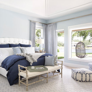 Bedroom - coastal master bedroom idea in Miami with blue walls