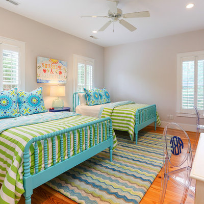 Inspiration for a coastal guest medium tone wood floor bedroom remodel in San Francisco with beige walls
