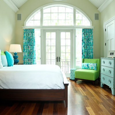 Beach style medium tone wood floor bedroom photo in Charleston with beige walls