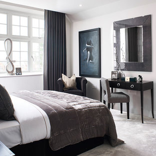 Photo of a medium sized classic bedroom in London with white walls, carpet and grey floors.