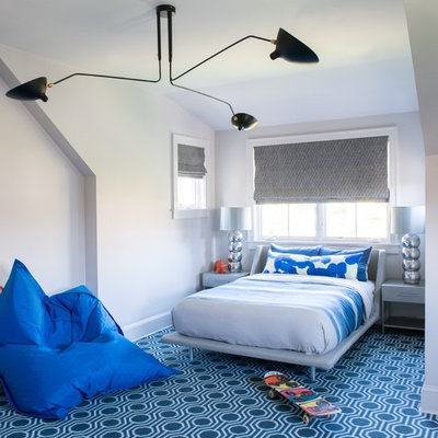 Example of a transitional carpeted and blue floor bedroom design in New York with gray walls