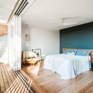 Inspiration for a mid-sized contemporary master bedroom in Sydney with white walls, light hardwood floors and beige floor.