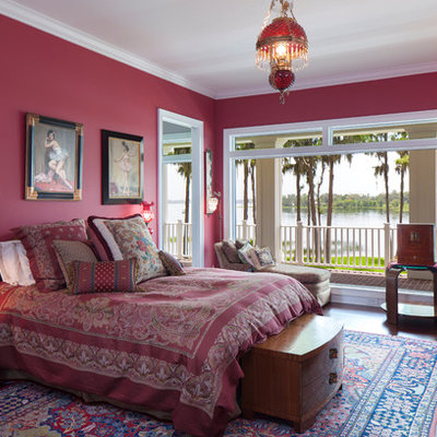 Large elegant master dark wood floor bedroom photo in Orlando with no fireplace and purple walls