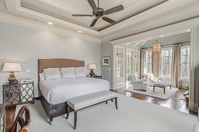 Example of a large classic master dark wood floor bedroom design in Atlanta with blue walls