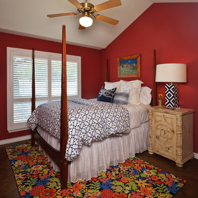 Mid-sized elegant guest concrete floor bedroom photo in Austin with red walls
