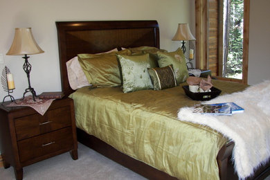 Example of a mid-sized mountain style master carpeted bedroom design in Other with beige walls and no fireplace