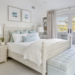 Beach style master carpeted and beige floor bedroom photo in Los Angeles with white walls