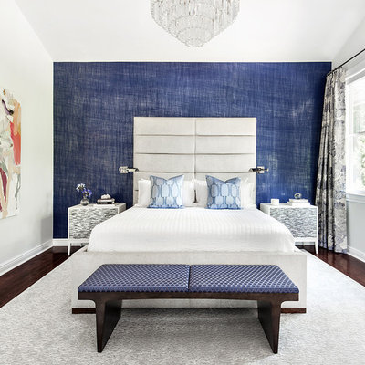 Inspiration for a transitional dark wood floor bedroom remodel in New York with blue walls